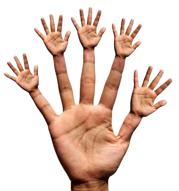 Tiny hands emerging from a human palm, symbolizing creativity, new ideas, and innovation in the music industry. Conceptual im